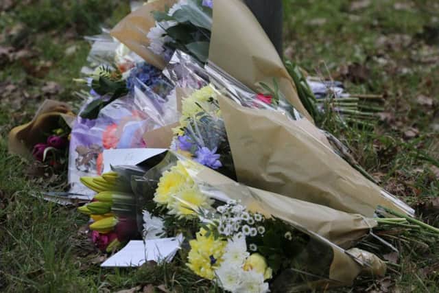 Flowers have been laid at the scene. Photo: Eddie Mitchell