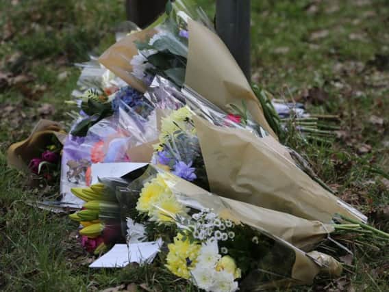 Flowers have been laid at the scene. Photo: Eddie Mitchell