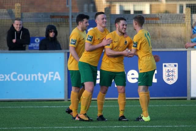 Horsham's Tom Tolfrey is congratulated on his winner against Phoenix Sports. Picture by John Lines