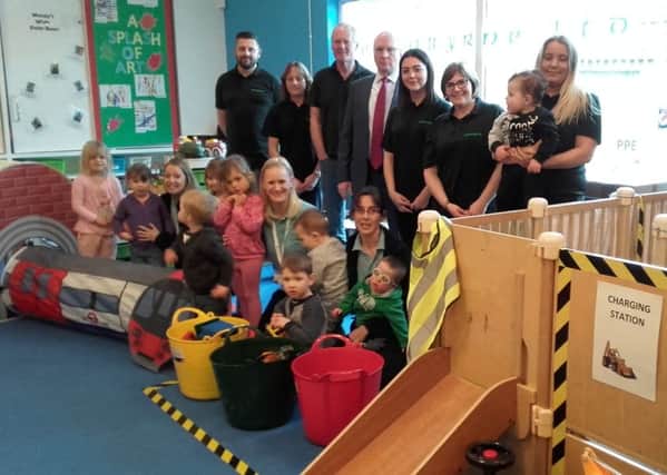 Ferrabyrne managing director Ken Horton and staff with children and staff in the new construction area at The Play Centre in Littlehampton