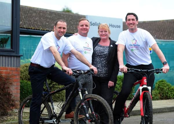 Directors of Ascia Construction, Neil Cole, and Rob Emery, and site manager Tim Brown prepare for their fundraising bike ride for the new Dementia Suuport Hub in Tangmere, here with Lesley-Anne Lloyd, fundraising manager for the new centre ks180072