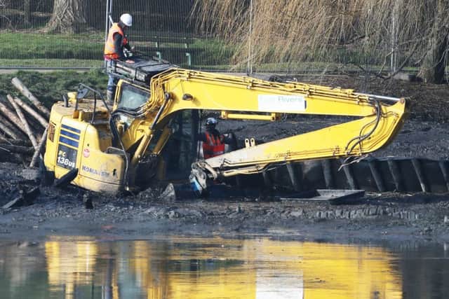 A digger got stuck in the mud in Brooklands Lake. Picture taken at 10am on February 21. Picture: Eddie Mitchell