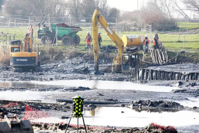 The digger was dredging Brooklands Lake as part of plans to revitalise the attraction. Picture: Eddie Mitchell