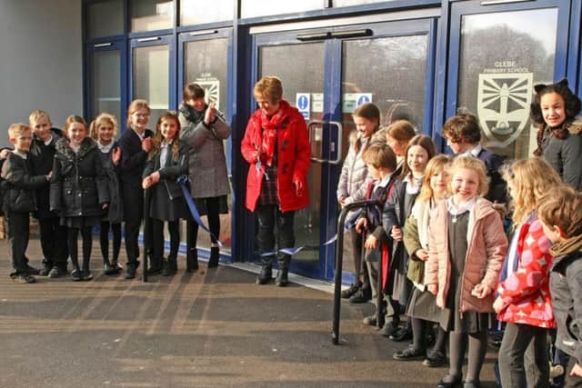 Shirley Osborne is applauded by head teacher Jo Kelly after cutting the ribbon to officially open the new extensions at Glebe Primary School. Pictures: Derek Martin DM1822902a