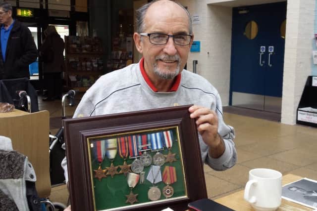 Tom Parke's son - Tom junior - with his father's medals