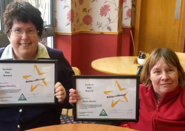 Burgess Hill volunteers Susan Chalkley (left) and Kerry Martin with their Sasbah star awards SUS-180226-170109001