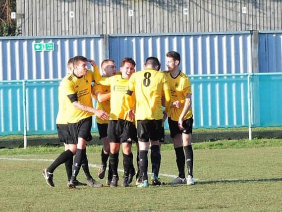 Golds celebrate Stephen Herbert's goal in the win at promotion-chasing Chichester City. Picture by Kate Shemilt KS180080
