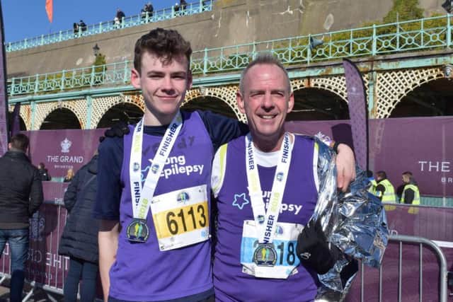 Proud dad Norman Cook with his son Woody after the half marathon