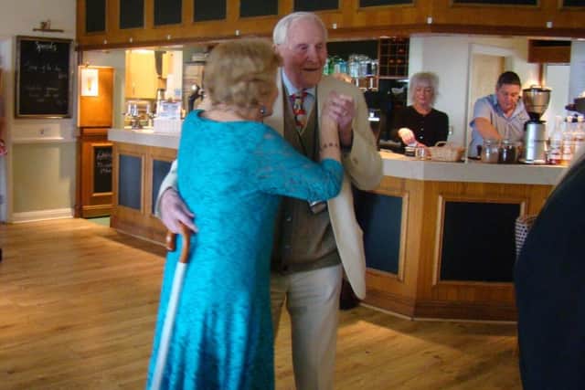 John and Joyce, his wife of 20 years, dancing at the celebration