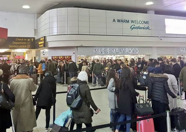 Queuing passengers at Gatwick Airport