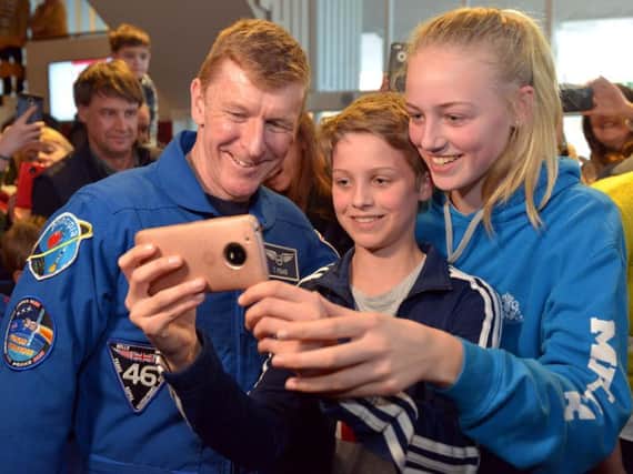 Tim Peake posing for a selfie with some young fans