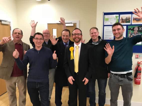 Matt Stanley, wearing a Lib Dem rosette, won the Bognor Regis Town Council and Arun District Council Marine ward by-elections