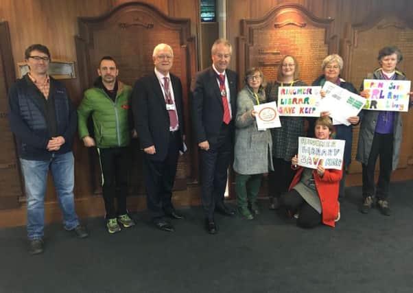 A petition to save Ringmer Library being handed over to East Sussex County Council's chairman at County Hall