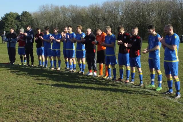 Rye Town carry out a minute's applause in memory of Chris Tutt and Burt Wilders, a well-known former local footballer and boxer respectively.