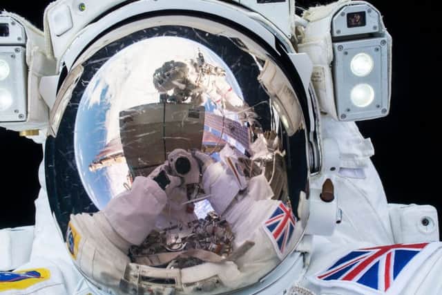 Anyone for a #SpaceSelfie? Here's Tim during his spacewalk