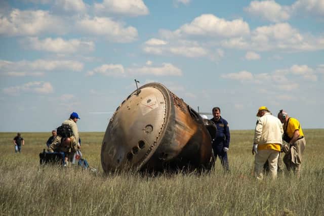 Russian support personnel work around the Soyuz spacecraft after it landed with Tim and his crewmates near the town of Zhezkazgan, Kazakhstan on Saturday, June 18, 2016. Picutre: NASA/Bill Ingalls