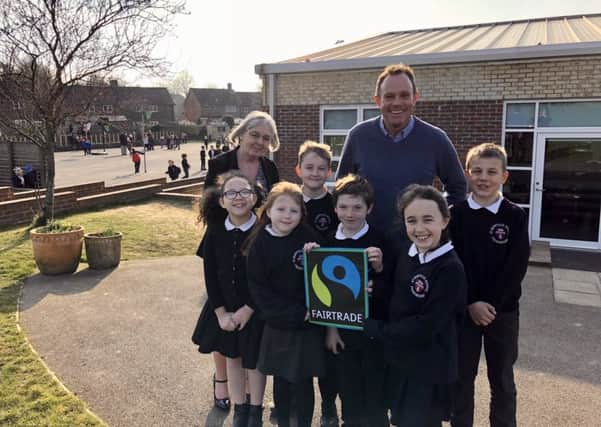 Nick Herbert with Joanna Brown, headteacher, and pupils from St Marys School in Pulborough SUS-180227-165507001
