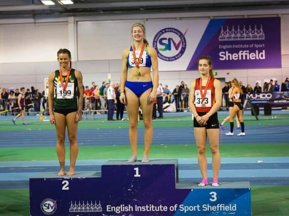 Beth Close (centre) stands tall on the podium in Sheffield. Picture by Angus Matheson (Sportsbeat)