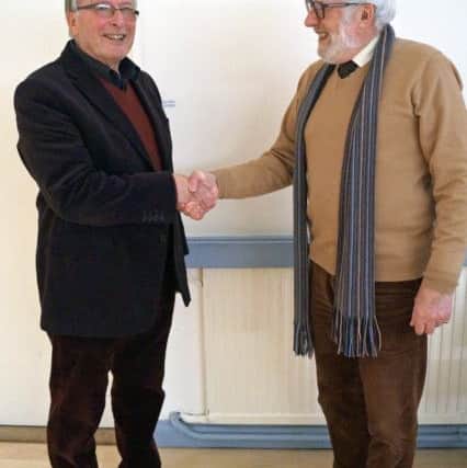 Past chairman John Rimmer is thanked by new chairman Geofrey Steward SUS-180228-115747001