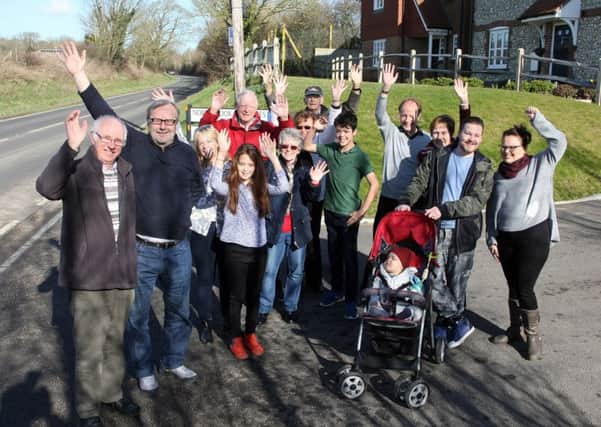 DM1822315a.jpg. Barry Burks, far left and beside him, cllr Sean McDonald with local residents celebrating the success of their campaign for a footpath along part of Titnor Lane, Durrington. Photo by Derek Martin Photography. SUS-180217-171119008