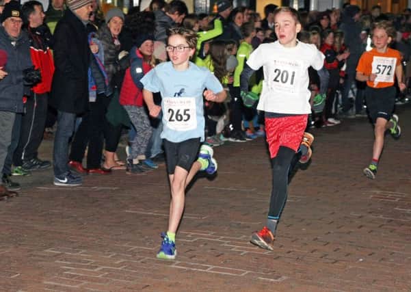 Action from one of the primary school races on the opening evening of the Chichester Corporate Challenge / Picture by Derek Martin