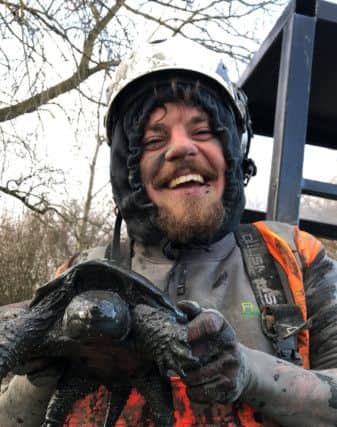 Five Rivers Site Technician Jimmy Griffiths with Terry the Snapping Turtle who was found at Brooklands Lake