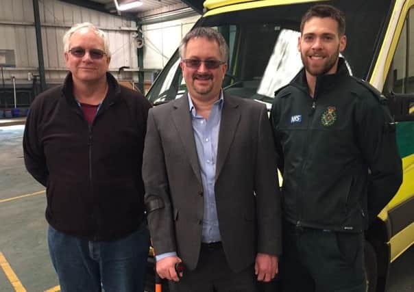 Jason with SECAmb staff who helped save him, Calum Burnett and Phil Swarbrick