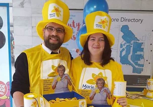 Volunteers collecting money for the Marie Curie Great Daffodil Appeal