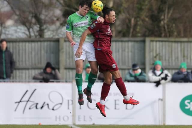 Dayshonne Golding goes up for a header during Hastings United's 1-1 draw away to Guernsey last weekend. Picture courtesy Scott White