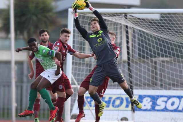 Charlie Horlock gathers a cross against Guernsey. Picture courtesy Scott White