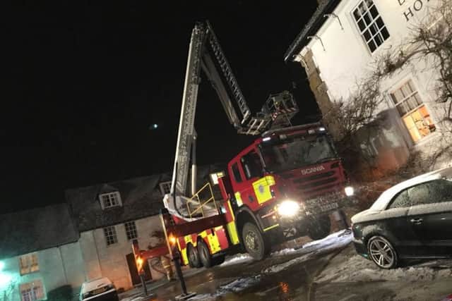 Crews using an ALP to tackle a chimney fire. Picture: Midhurst Fire Station