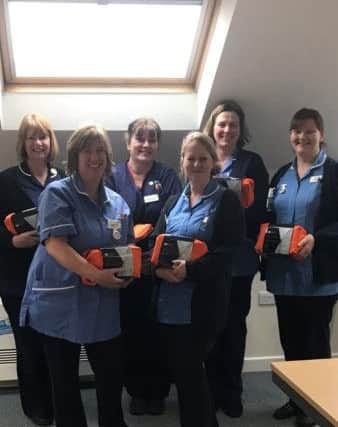 The Chanctonbury community nursing team with their cold weather packs courtesy of Littlehampton-based company The Car Surgery in Wick