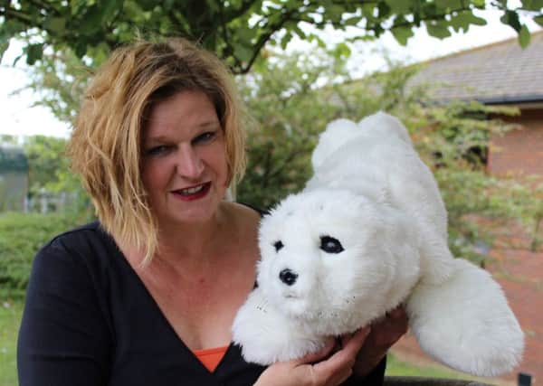 Lead researcher Dr Penny Dodds, formerly from the University of Brighton, with Paro the robotic therapy seal pup