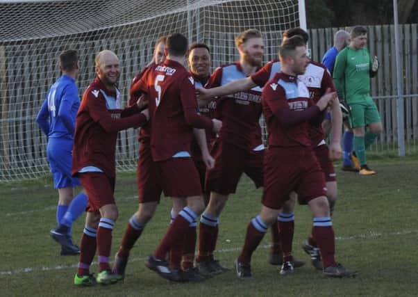 Little Common celebrate scoring during their last outing, against Selsey, two weeks ago. Picture by Simon Newstead