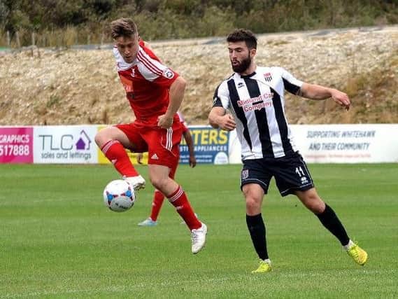Jake Robinson, in action for former club Whitehawk, is backing Worthing to reach National League South