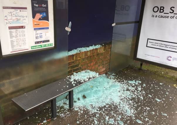 Smashed bus shelter in Brighton Road.