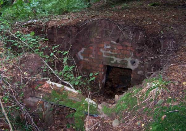 Remains of a typical operational base in dense woodland