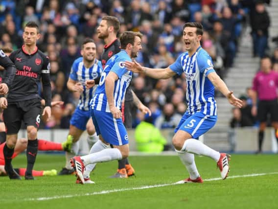 Lewis Dunk celebrates scoring against Arsenal. Picture by Phil Westlake (PW Sporting Photography)