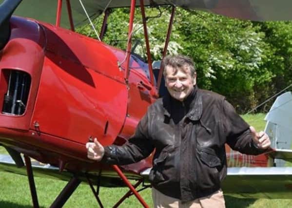 Peter Holland, 80 years old, having just taken a quick spin in an old Tiger Moth 2015 SUS-180603-105219001