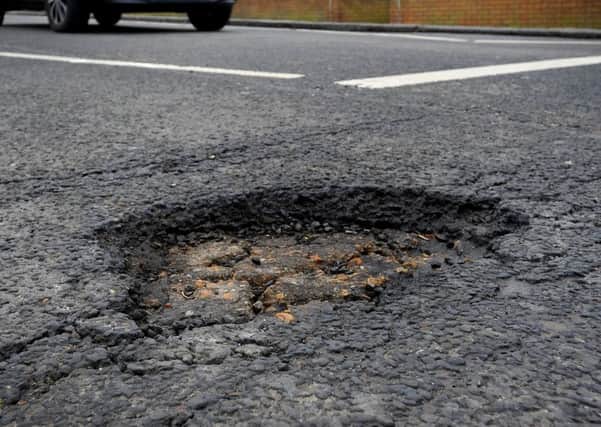 A pothole in London Road, Burgess Hill. Picture: Steve Robards