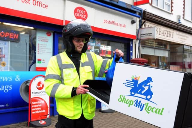 Adam Philpott, the creator of Shop My Local, delivering goods from Wick Newsagents in Wick Street, Wick. Picture: Kate Shemilt