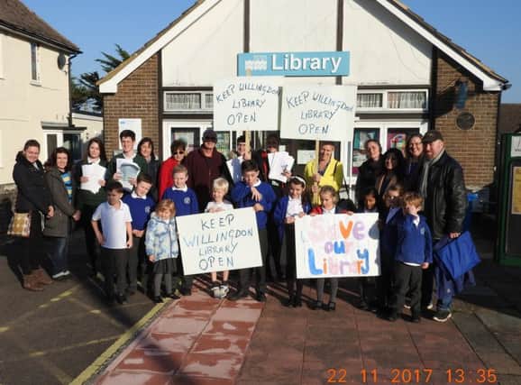 Headteachers and pupils outside Willingdon Library SUS-180703-104403001