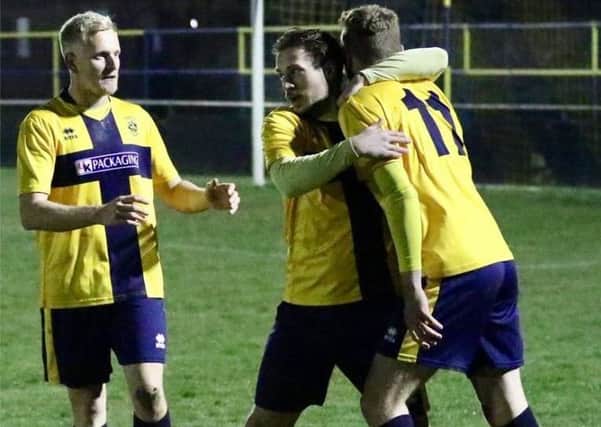 Eastbourne Town celebrate their opening goal at the Saffrons