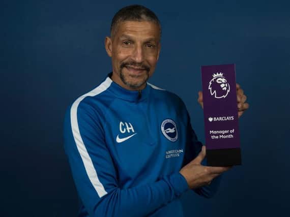 Chris Hughton with his manager of the month award. Picture by Paul Hazlewood/BHAFC
