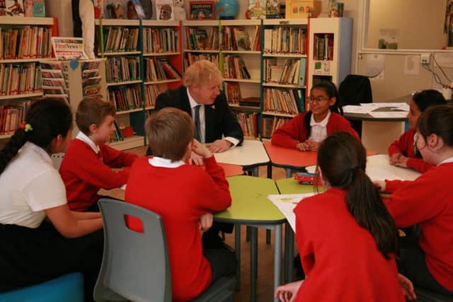 Boris Johnson in a round-table discussion with pupils SUS-180903-132621001