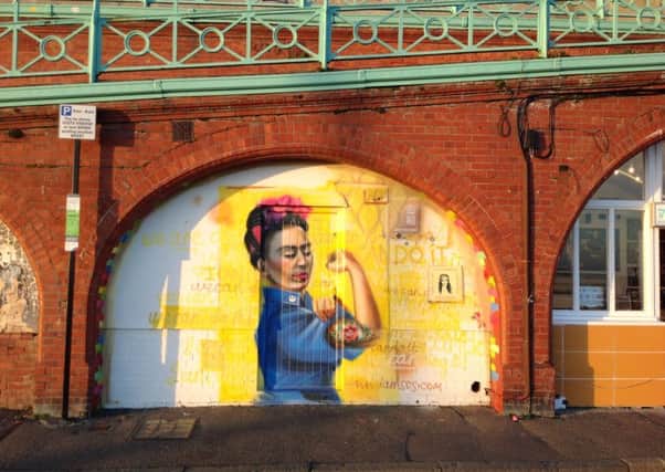 Sarah Gillings' International Women's Day mural at Madeira Drive; a mash-up of J.Howard Millers iconic'We can do it!' poster, in a portraiture style of historically famous feminist artist, Frida Kahlo