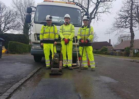 Highways crews with the fixed pothole