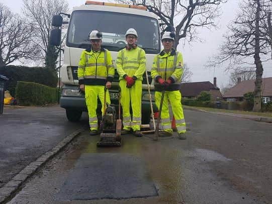 Highways crews with the fixed pothole