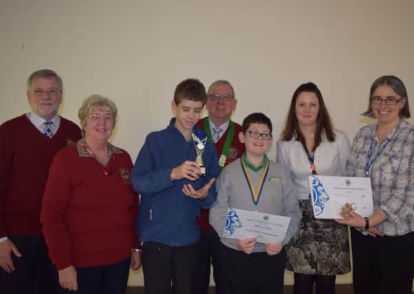 Lions Club members, St Mary's staff and winners of the Peace Poster competition.