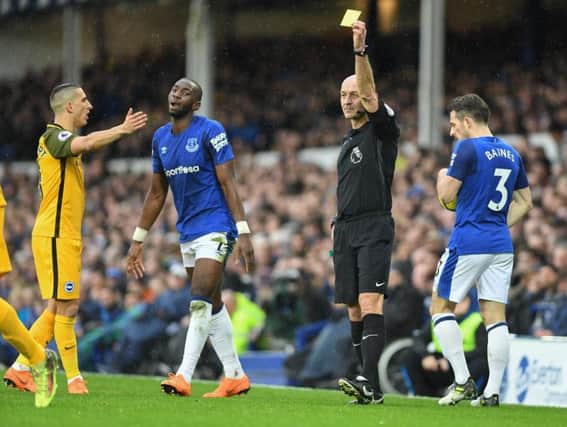 Anthony Knockaert complains about a booking to referee Roger East at Everton. Picture by Phil Westlake (PW Sporting Photography)